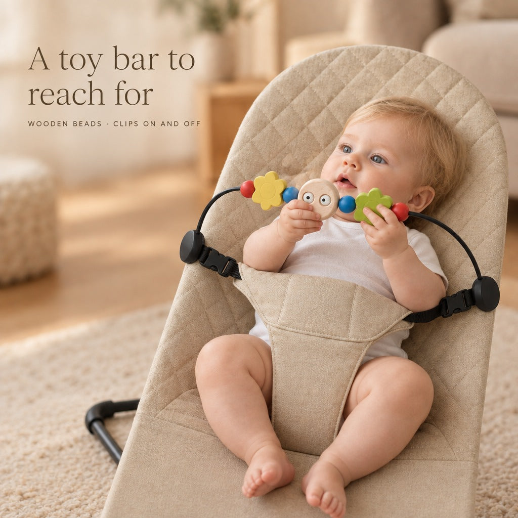 Baby reaching for the wooden toy bar on the bouncer