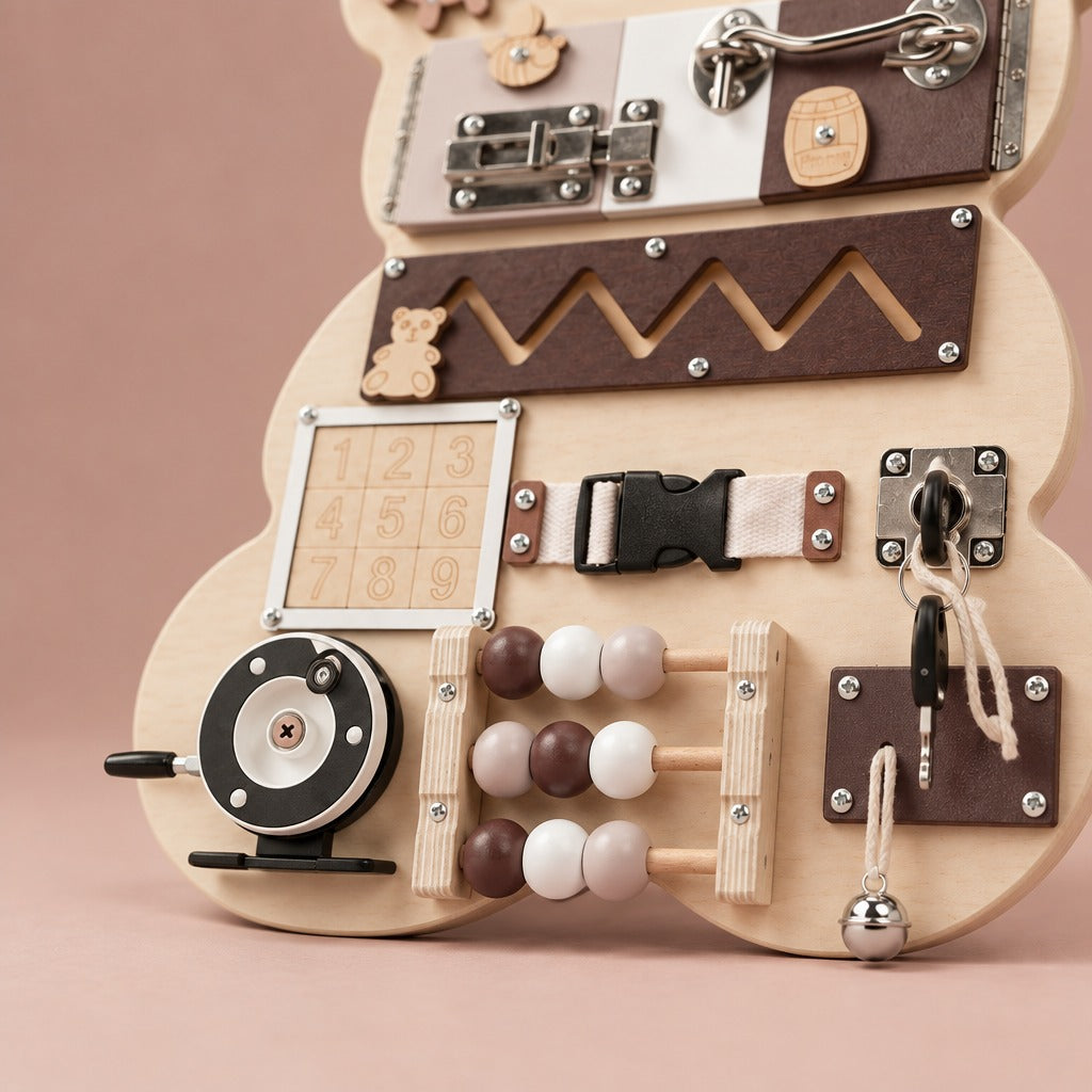 Close-up of the counting beads, reel and key on the bear busy board