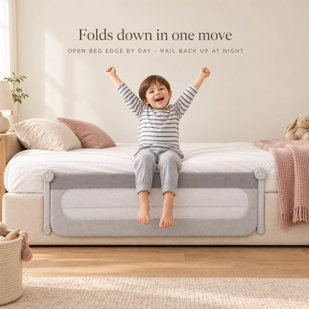 Bed rail folded down below the mattress while a child sits on the open bed edge - folds down in one move