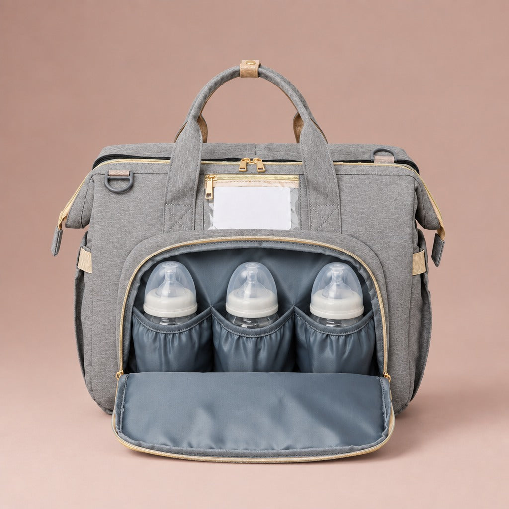 Front pocket of the changing bag holding three baby bottles