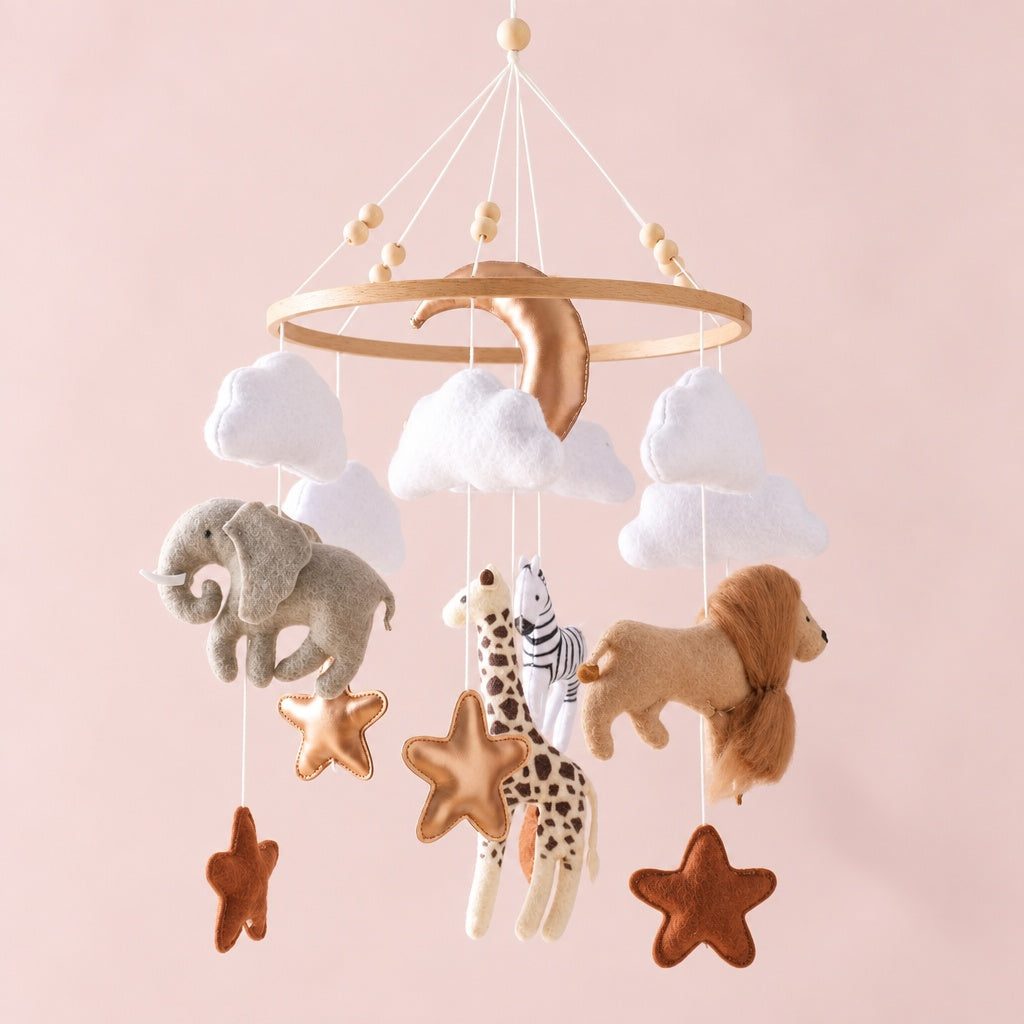 Felt crib mobile with elephant, giraffe, zebra, lion, white clouds, moon and stars on a beech wood ring