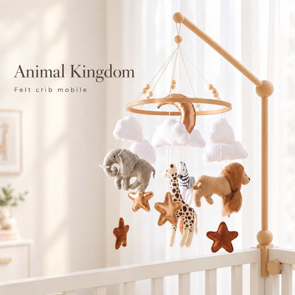 Animal Kingdom felt crib mobile hanging over a white crib