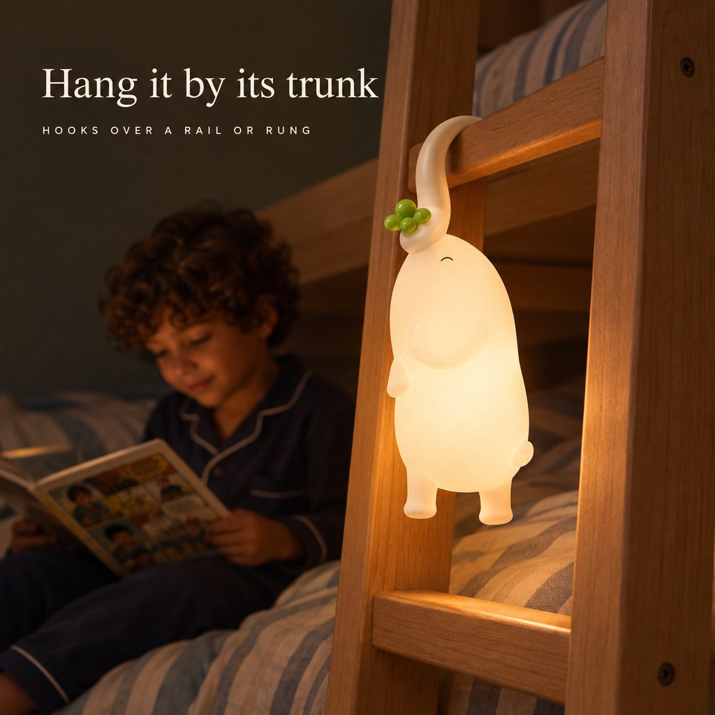 Elephant night light hanging by its trunk on a bunk bed ladder — Hang it by its trunk