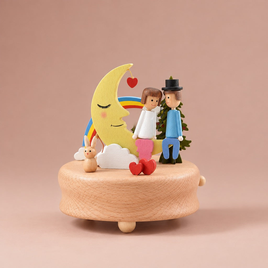 Wooden music box with a sleeping moon, rainbow and a couple