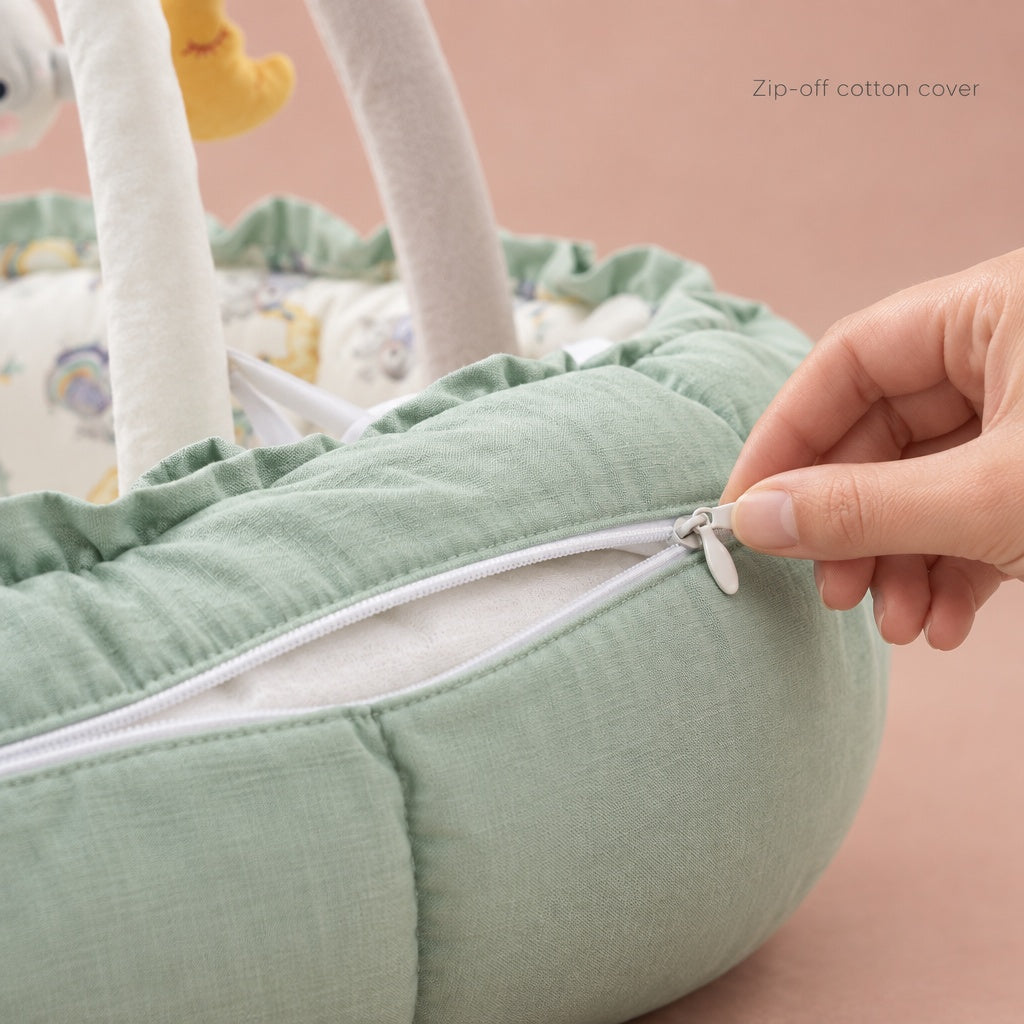 Hand opening the zipper of the removable cotton cover on the play gym nest