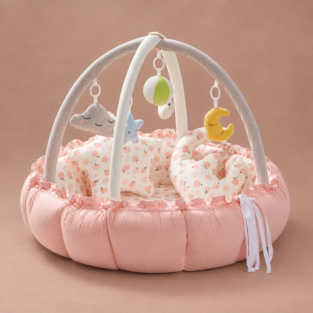 Baby play gym nest in pink with fruit print lining, play arch and hanging toys