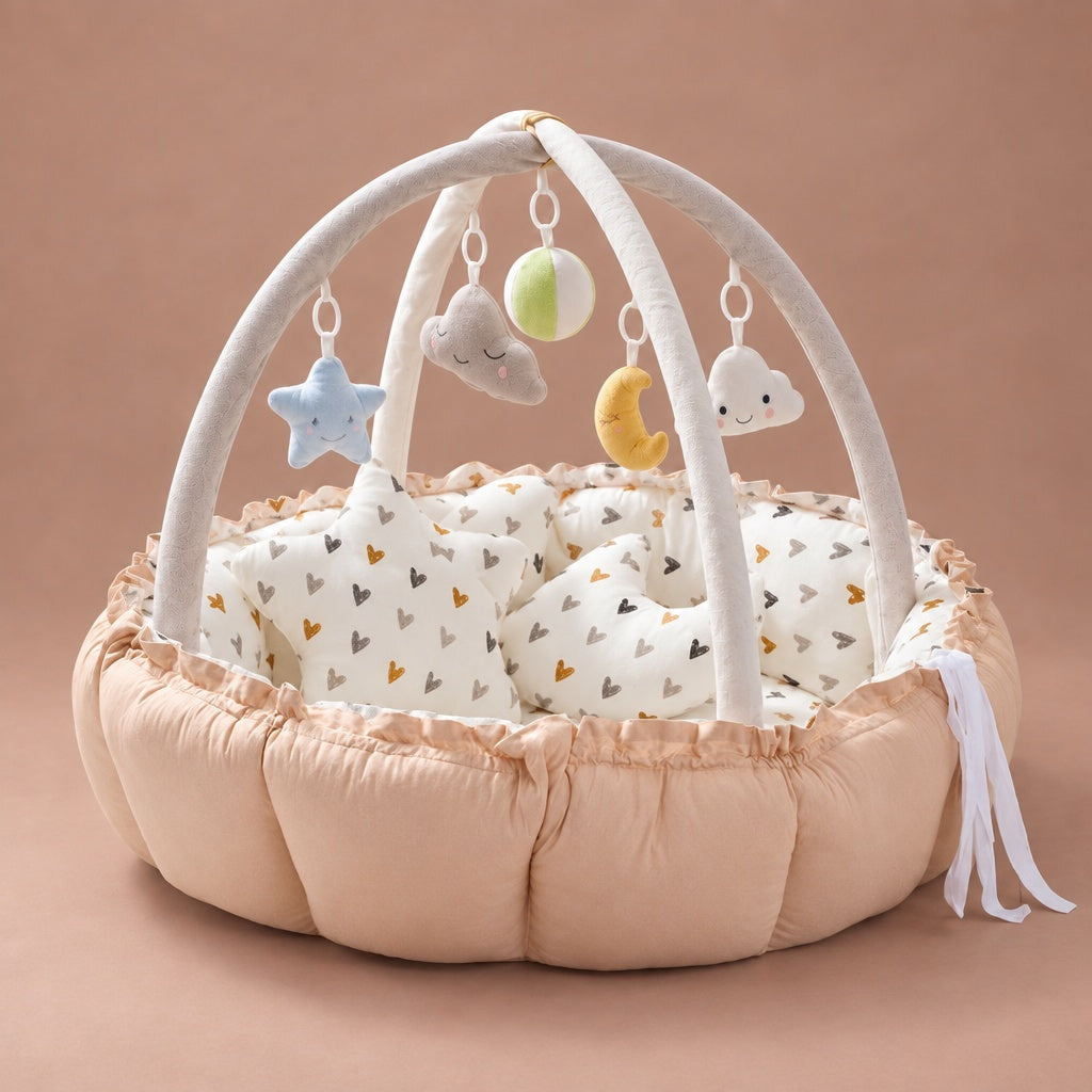 Baby play gym nest in warm yellow with heart print lining, play arch and hanging toys