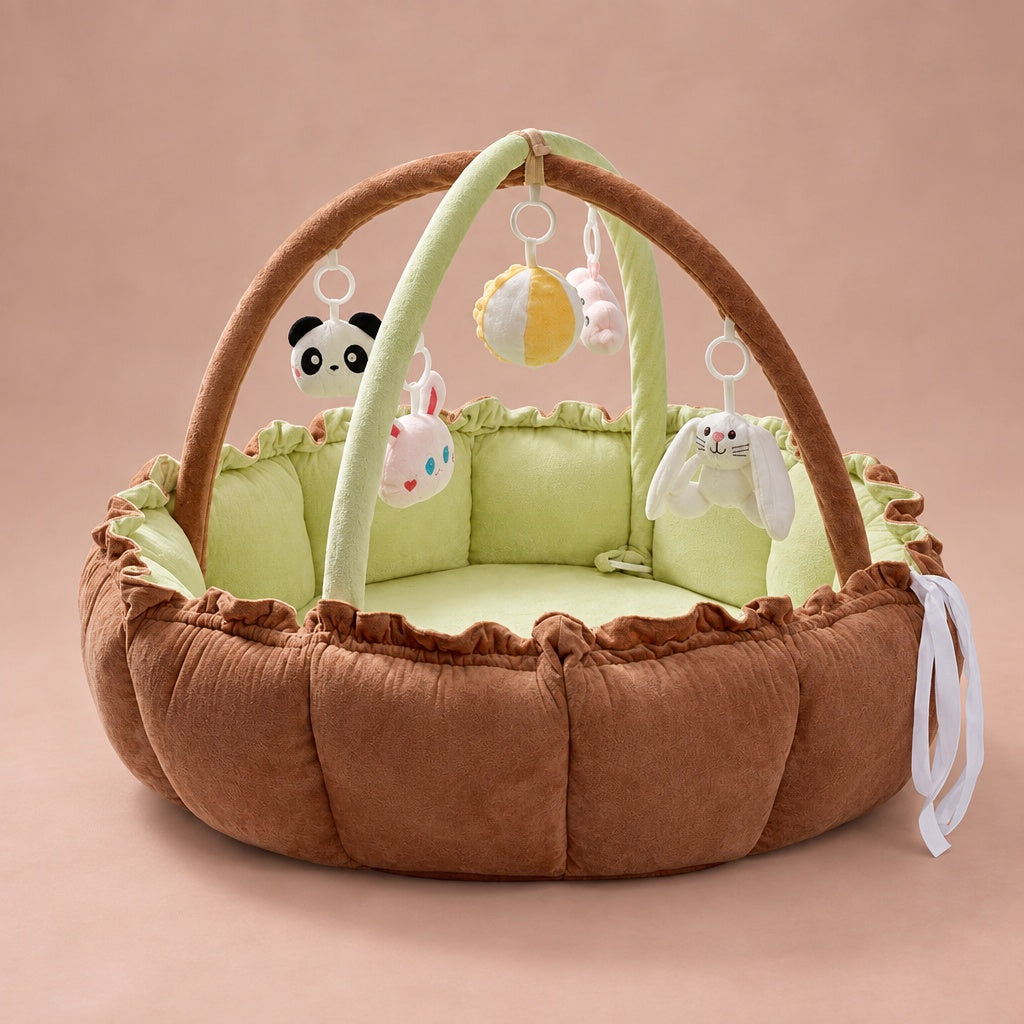 Baby play gym nest in caramel velvet with light green lining, play arch and hanging plush animal toys