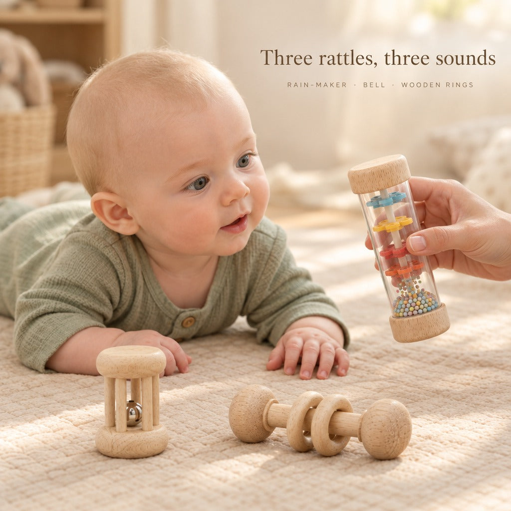 Baby on tummy watching the rain-maker rattle - three rattles, three sounds
