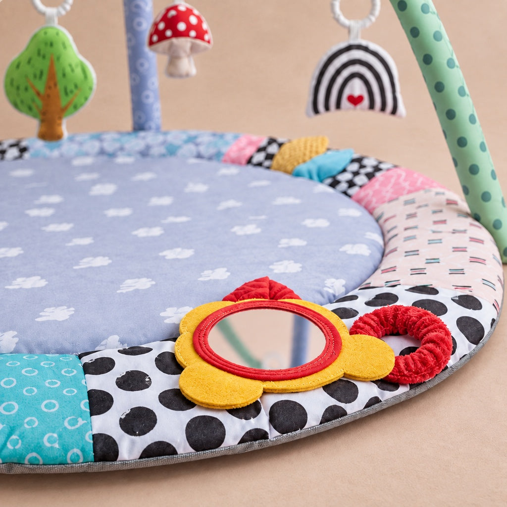 Close-up of the yellow flower mirror and red ring on the play mat border
