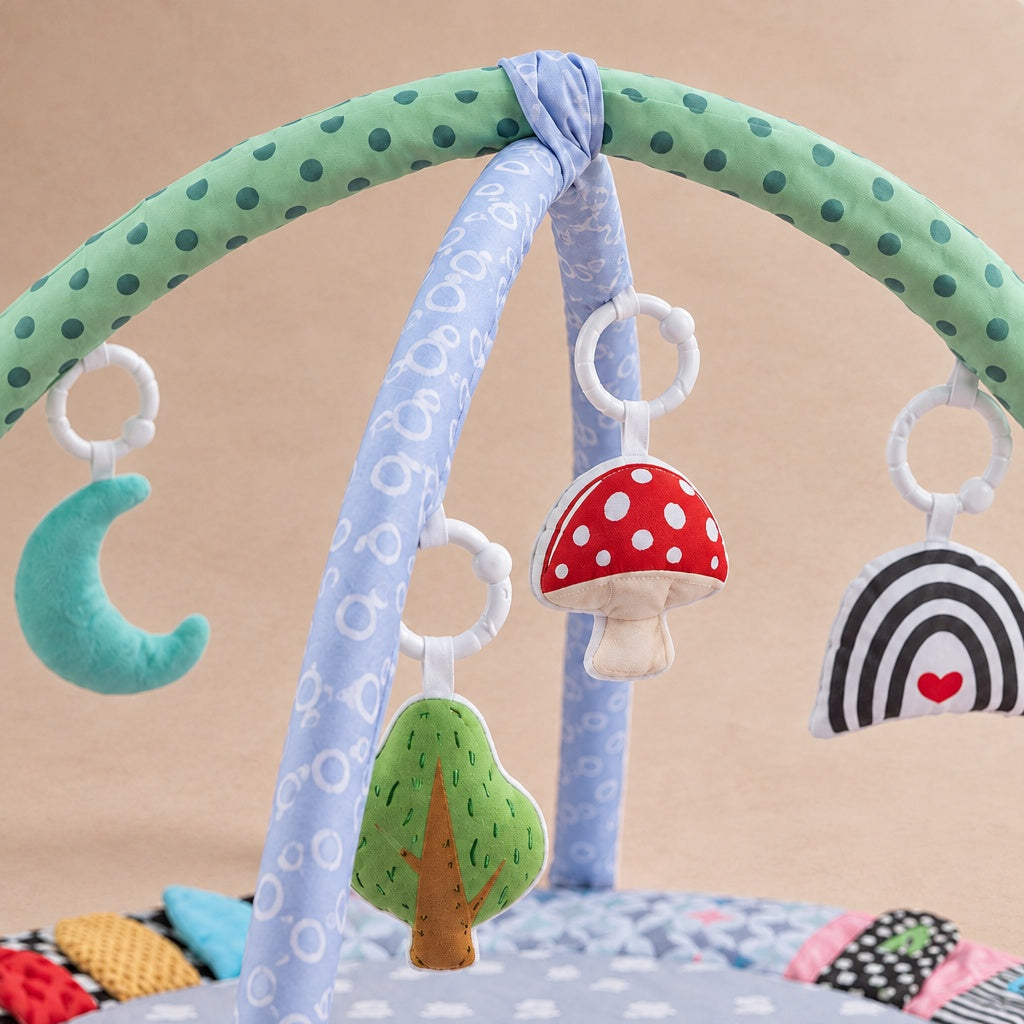 Close-up of the hanging moon, mushroom, tree and rainbow toys