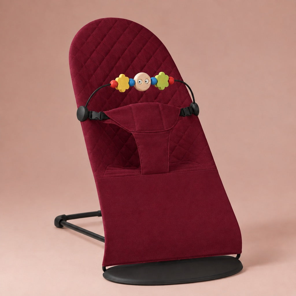 Wine red quilted cotton baby bouncer with wooden toy bar and black frame