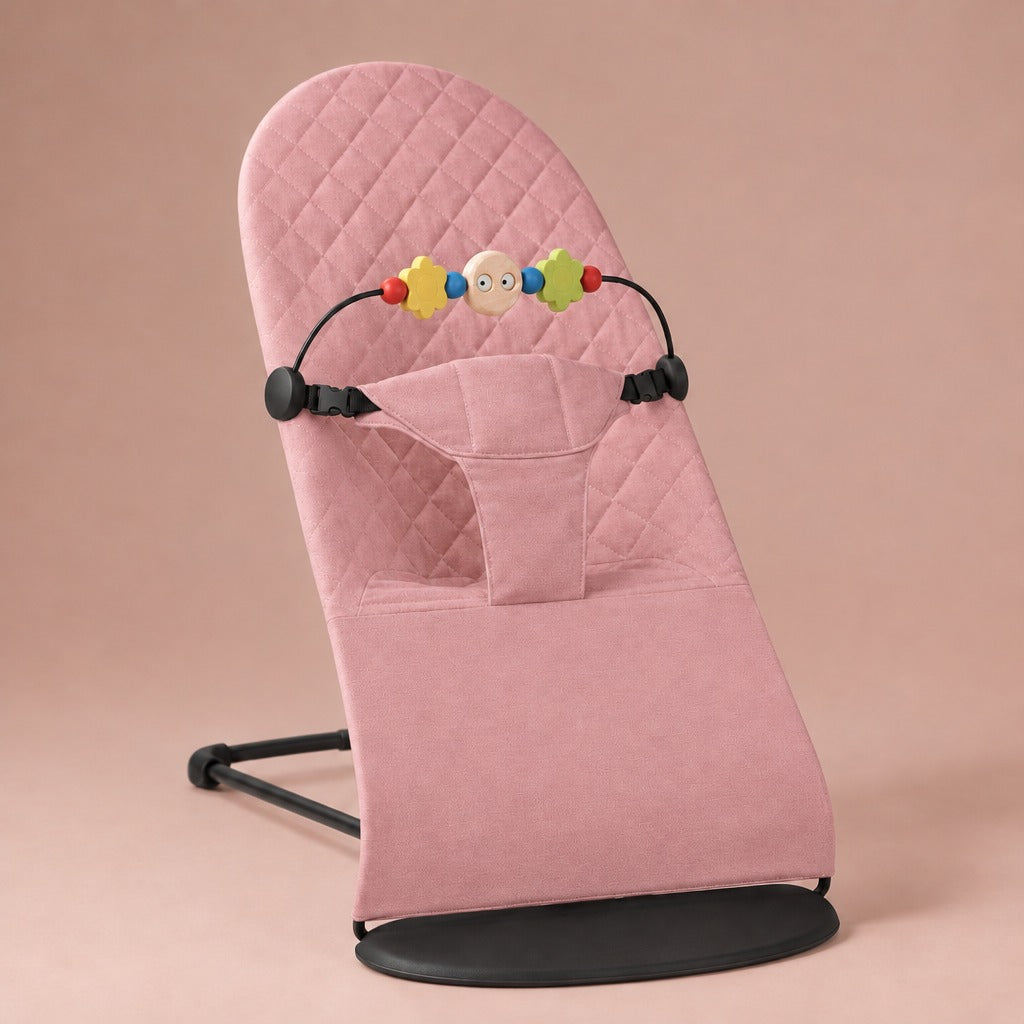 Pink quilted cotton baby bouncer with wooden toy bar and black frame