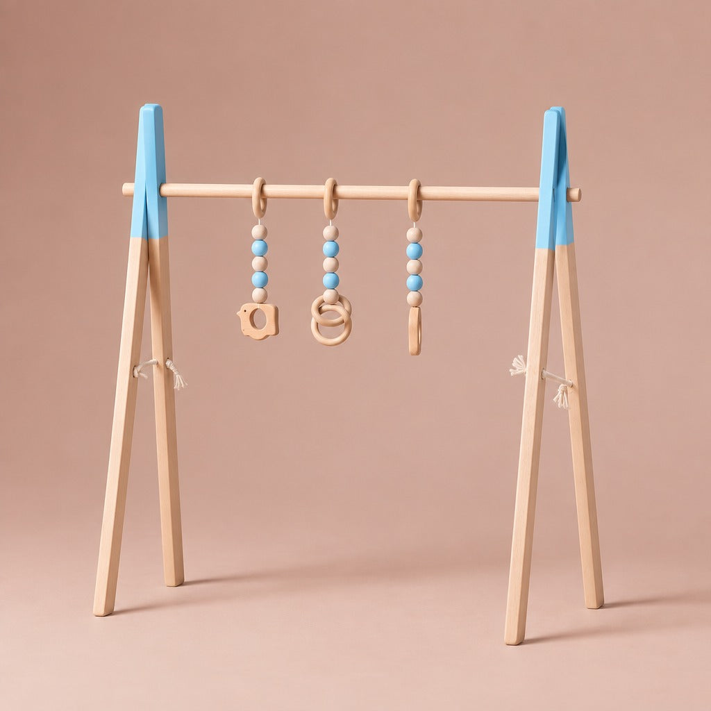 Wooden baby play gym with blue painted tops and three hanging toys