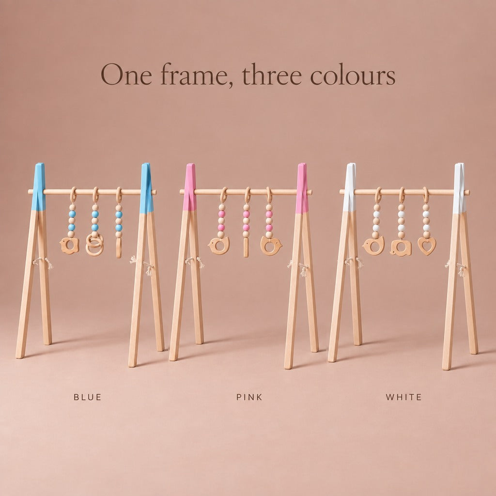 Wooden baby play gym in three colours: blue, pink and white